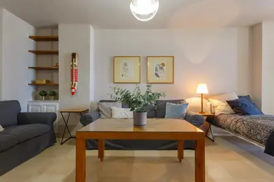 a living room with a couch and a table at BLUE Atlantic Family Home by Cadiz4Rentals in Cádiz