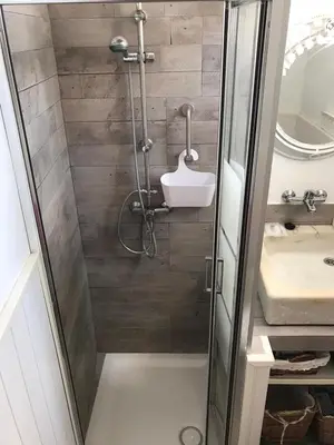 a bathroom with a shower and a sink at Ático Baños del Carmen in Cádiz