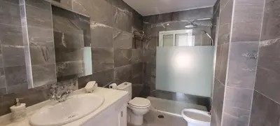 a bathroom with a sink and a toilet at ARENA & SOUL SUITe in El Puerto de Santa María