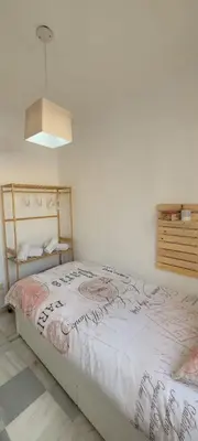 a bedroom with a bed in a room at ARENA & SOUL SUITe in El Puerto de Santa María