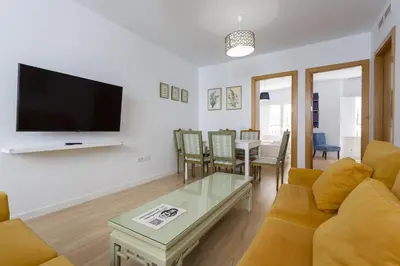 a living room with a couch and a table at COLON15 Family Home by Cadiz4Rentals in Cádiz