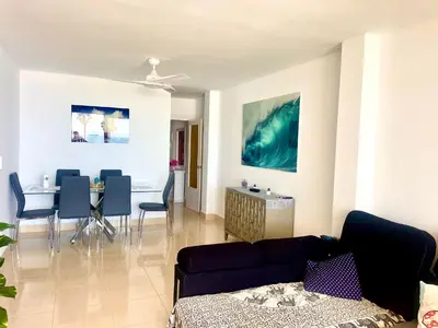 a living room with a couch and a table at vistas maravillosas in Chipiona