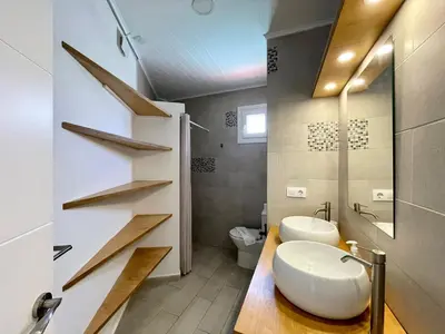 a bathroom with a white sink and a toilet at Minichalet El Molino 5 in Chiclana de la Frontera