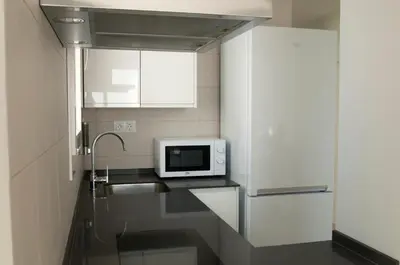 a kitchen with a sink and a microwave on a counter at El mirador de Ancha in Cádiz