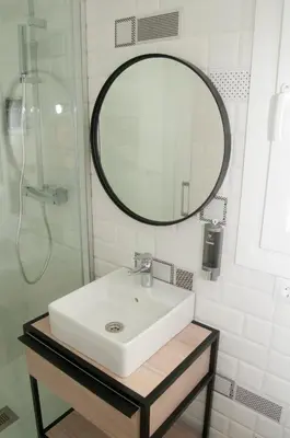 a bathroom with a sink and a mirror at El mirador de Ancha in Cádiz