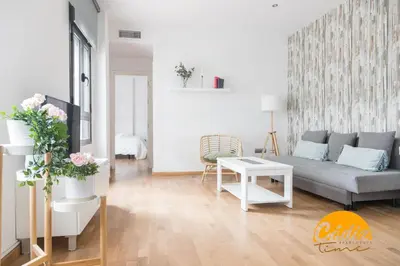 a living room with a couch and a table at Apartamento Caleta - FREE PARKING by Cadiz Time in Cádiz