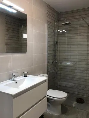a bathroom with a sink and a toilet and a shower at Villas Santa Ana in Conil de la Frontera
