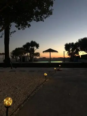 a group of lights in a park at sunset at Villas Santa Ana in Conil de la Frontera