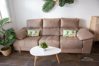 a brown couch in a living room with a table at Apartamento Cañadilla MRZ Rentals in El Puerto de Santa María