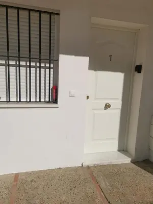an empty room with a white door and a window at Apartamento Cañadilla MRZ Rentals in El Puerto de Santa María