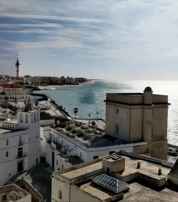 a view of the ocean from the roofs of buildings at Sunset Caleta in Cádiz