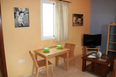 a bathroom with a sink and a toilet at DescubreHome Playa de la Caleta in Cádiz