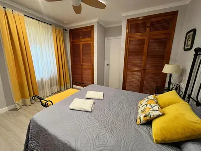 a bedroom with a bed with two towels on it at Lemon Tree Corazón de Cádiz Grupo AC Gestion in Cádiz