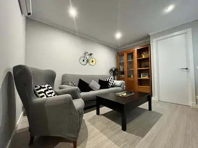 a living room with a couch and a table at Lemon Tree Corazón de Cádiz Grupo AC Gestion in Cádiz
