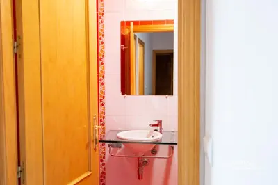 a bathroom with a sink and a mirror at Apartamento Lapa MRZ Rentals in El Puerto de Santa María