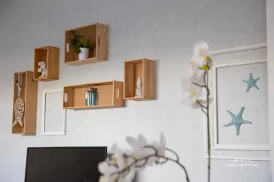 a wall with wooden shelves on a wall at Apartamento Lapa MRZ Rentals in El Puerto de Santa María