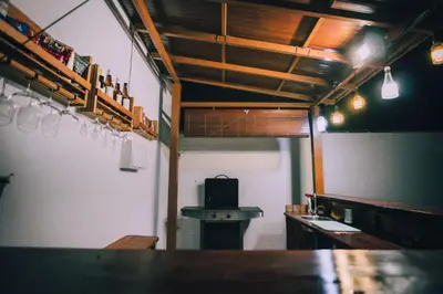 a room with a counter and a table in a restaurant at La Guareña in Chiclana de la Frontera