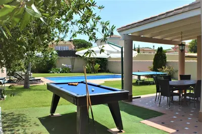 an overhead view of a pool with a table and balls at VILLA FLAMINGO in Chiclana de la Frontera