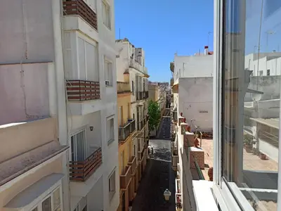 a view from a window of an alley between buildings at Viña 41 in Cádiz