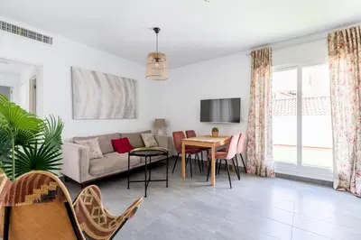 a living room with a couch and a table at Sanlúcar Olehousing in Sanlúcar de Barrameda