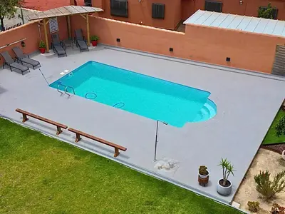 an overhead view of a swimming pool in a backyard at Loft con Piscina ADULTS ONLY in Chiclana de la Frontera