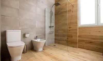 a bathroom with a toilet and a glass shower at Terraza Playa de Cádiz 2 Ha Apartment in Cádiz