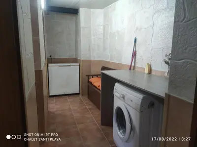 a laundry room with a washer and dryer at Apartamento Fez playa de la barrosa in Chiclana de la Frontera