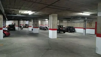 a parking lot with cars parked in a parking garage at Sherryflat La Estación - Parking in Jerez de la Frontera