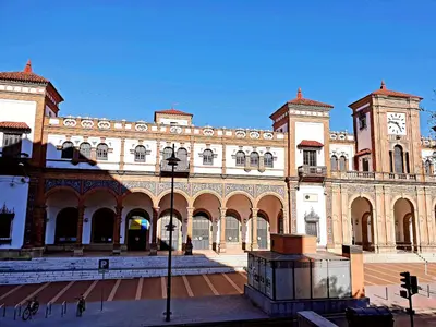a large building with a clock on the front of it at Sherryflat La Estación - Parking in Jerez de la Frontera