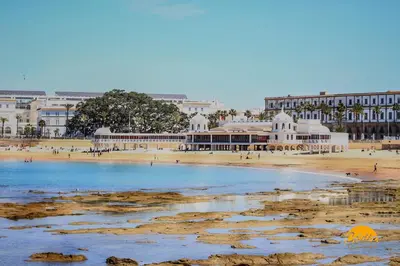 a view of a beach with buildings in the background at Corazon del Mar - FREE PARKING by Cadiz Time in Cádiz