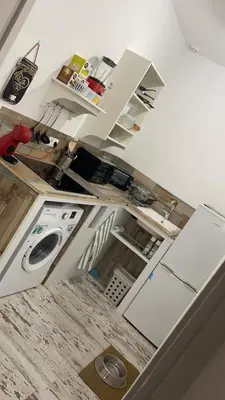 an overhead view of a kitchen with white cabinets at LA CUEVA DEL LOCO, Bretones 29 in Sanlúcar de Barrameda