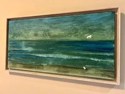 a painting of the ocean with two birds flying over it at GATU Herrería in El Puerto de Santa María