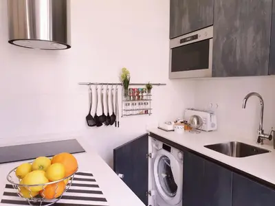 a kitchen with a bowl of fruit on a counter at Sherryflat Plateros in Jerez de la Frontera