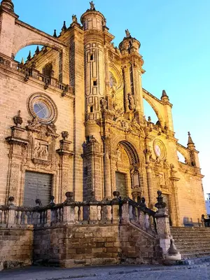 an old building with a fence in front of it at Sherryflat Plateros in Jerez de la Frontera