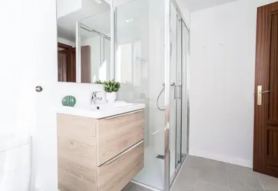 a bathroom with a sink and a mirror at APARTOYOU PREMIUM - Apartamentos Casa Linares in El Puerto de Santa María