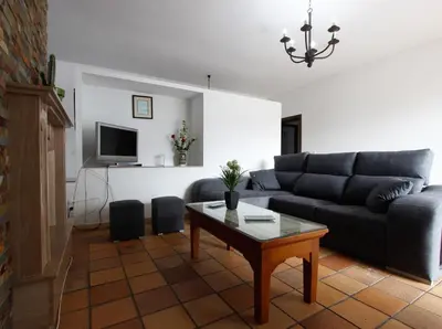a living room with a couch and a coffee table at VILLA ELLY in Conil de la Frontera