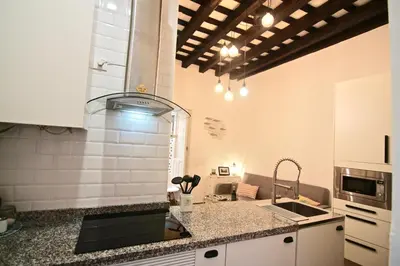 a kitchen with a sink and a counter top at Apartamento Oh Cádiz in Cádiz