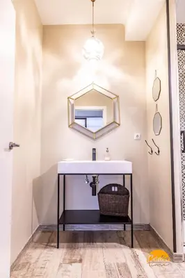 a bathroom with a sink and a mirror at La Luz de Cadiz by Cadiz Time in Cádiz