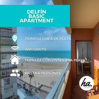 a view of the beach from the balcony of a building at Delfín Playa Basic Ha Apartment in Cádiz
