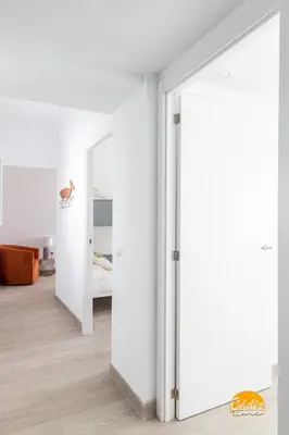 an open door in a room with a bedroom at Apartamento Vintage by Cadiz Time in Cádiz