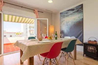 a bedroom with a bed and a mirror at Atico La JOYITA free parking by Cadiz4Rentals in Cádiz