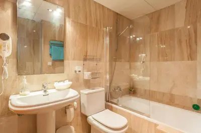 a bathroom with a toilet and a sink and a shower at Atico La JOYITA free parking by Cadiz4Rentals in Cádiz