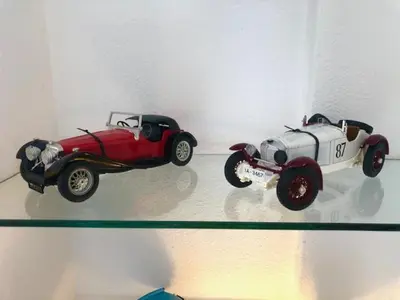 two toy cars are on display on a wall at GATU Vista Infinita 1ªlinea mar WIFI, AIRE ACC, TERRAZA CON VISTAS in Cádiz