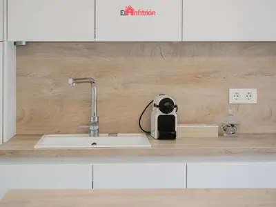 a kitchen counter with a sink in a kitchen at DUPLEX NUEVO CONVENTO PLAZA CABILDO in Sanlúcar de Barrameda