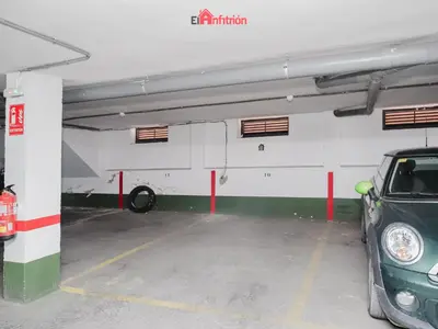 a parking garage with a car parked in it at DUPLEX NUEVO CONVENTO PLAZA CABILDO in Sanlúcar de Barrameda