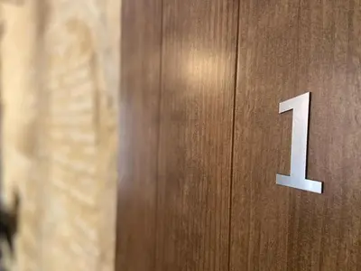 a wooden door with the number one on it at GADEIRAS SUITES - Apartamentos Turísticos de 2 llaves in Cádiz