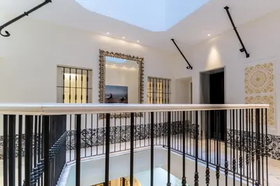 a view of the balcony of a house with a mirror at Suite Capitán 3 in Cádiz