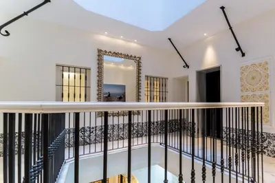 a view of the balcony of a house with a mirror at Suite Capitán 1 in Cádiz
