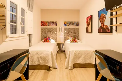 a room with two beds in a room at Suite Capitán 2 in Cádiz