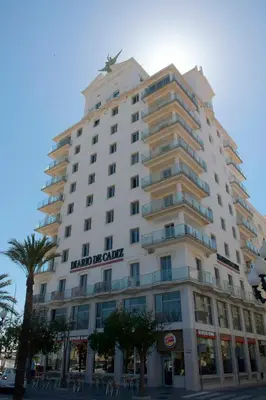 a large white building with a sign on it at Skyline - Penthouse with 50m2 private terrace and stunning views in Cádiz